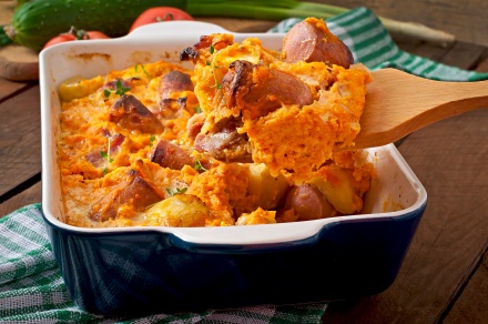 Casserole with sausage, bacon and apples in a pumpkin sauce